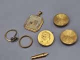 some gold coins and a keychain are sitting on a table
