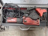 a tool that is sitting in a case on the ground