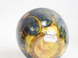 a ball with a clock on it sitting on a table