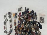 a pile of badges and other items on a table