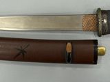 two knives that are sitting next to each other on a table