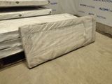 several mattresses stacked on top of each other in a warehouse