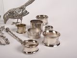 a lot of silver objects that are on the table