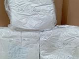 boxes of toilet paper stacked on top of each other on top of a table