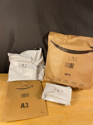 a bag of food sitting on a table next to a bag of food