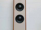 two speakers that are sitting on top of a table