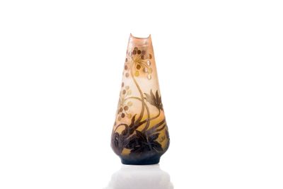 a glass vase with a floral design on it