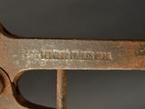 a close up of an old wrenet on a table