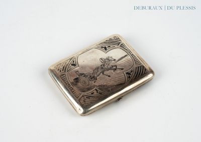 a silver cigarette case with a picture of a man riding a horse