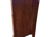 an image of a wooden cabinet with a door open