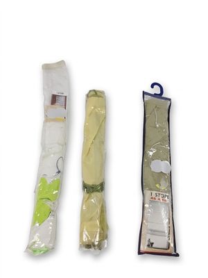 three umbrellas that are wrapped in plastic on a white background