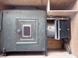 a metal box with a metal door and a metal door on it