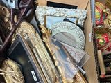 a cardboard box full of assorted items in it