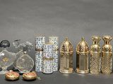 many different types of perfume bottles on the table
