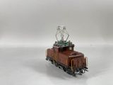 a toy train with a radio tower on top of it