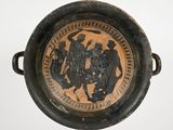 a black and brown bowl with a picture of a man and a woman on it
