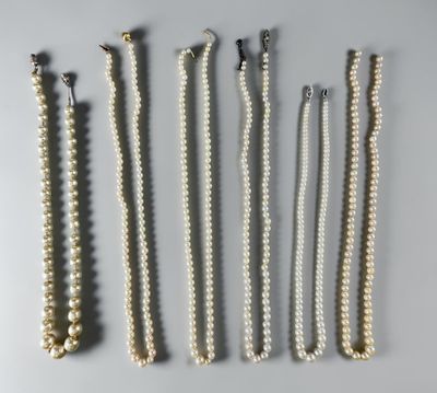 six pairs of pearl necklaces and a pair of earrings