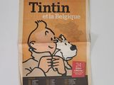 journal dont la une montre la photo d'un enfant et d'un chien