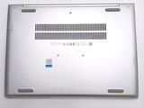 a silver laptop that is sitting on a table