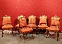 Suite de six chaises en noyer mouluré et sculpté, modèle à l…