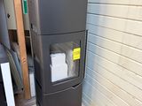 a refrigerator and a refrigerator freezer in a room