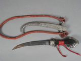 a knife and a rope on a table