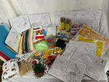 a pile of art supplies on a white sheet of paper