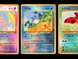 three pokemon cards with different designs on them on a black background