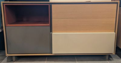 a wooden cabinet with two different colors on it