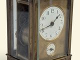a small clock that is sitting on a table