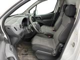 the interior of a small car with a steering wheel and a dashboard