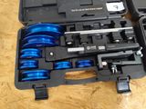 a black case with blue wheels inside of it on a table