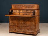 an old wooden desk with drawers and drawers on top of it