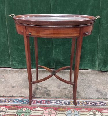 a table with a tray on top of it on a rug
