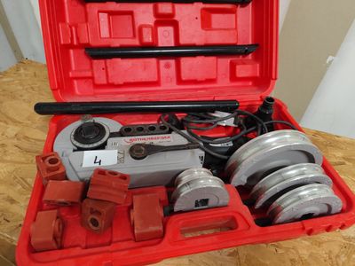 a red case with a bunch of tools inside of it