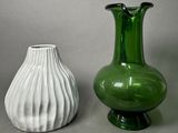 two vases sitting next to each other on a table