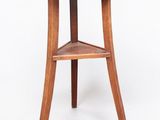 a small wooden table with a shelf on top of it