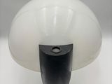 an image of a black and white lamp on a white surface