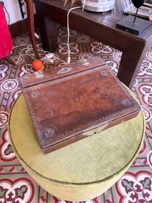 a small wooden box sitting on top of a table