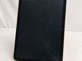 an image of a black tablet computer sitting on top of a white table