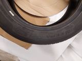 a tire that is sitting on top of a cardboard box