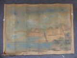 a close up of a piece of cloth with a painting on it