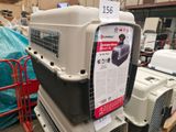 many different types of pet carriers stacked on top of each other