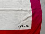 chanel red and white scarf with logo on it