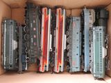 a box full of toy trains sitting on a table