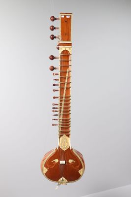 a close up of a musical instrument on a white surface