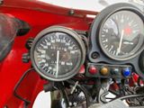 a close up of a motorcycle with a speedometer and gauges on it