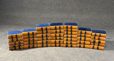 many stacks of books stacked on top of each other