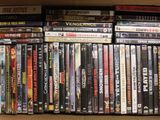 a box full of dvds sitting on a shelf