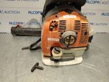 an image of a chainsaw sitting on top of a table